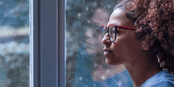 Woman looking out a window