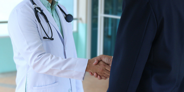 Doctor and patient shaking hands