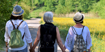 Women holding hands